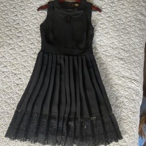 Eva Franco Women's Black Dress with Collar and bow. Pleated skirt with lace. 2